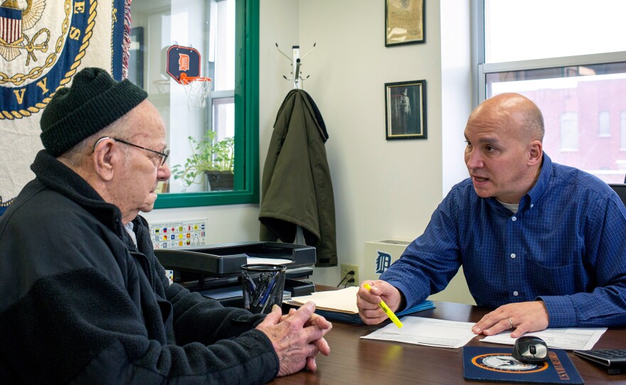 Grant County Veterans Service Officer Bob Kelley, right, works with World War II Army veteran Frederick Kern at the Grant County Government Building in Marion, Ind., on Monday.