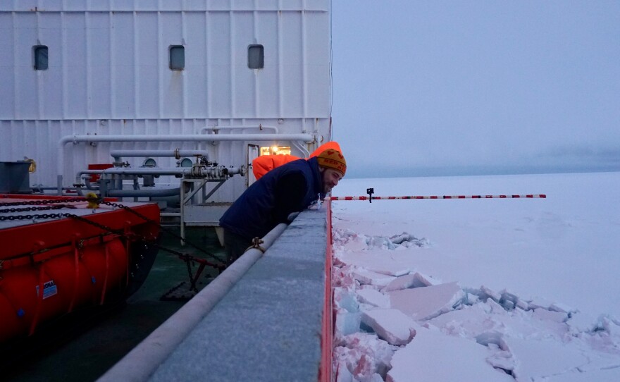 Ian Raphael watches as the Akademik Fedorov tests the thickness of an ice floe by driving through it.