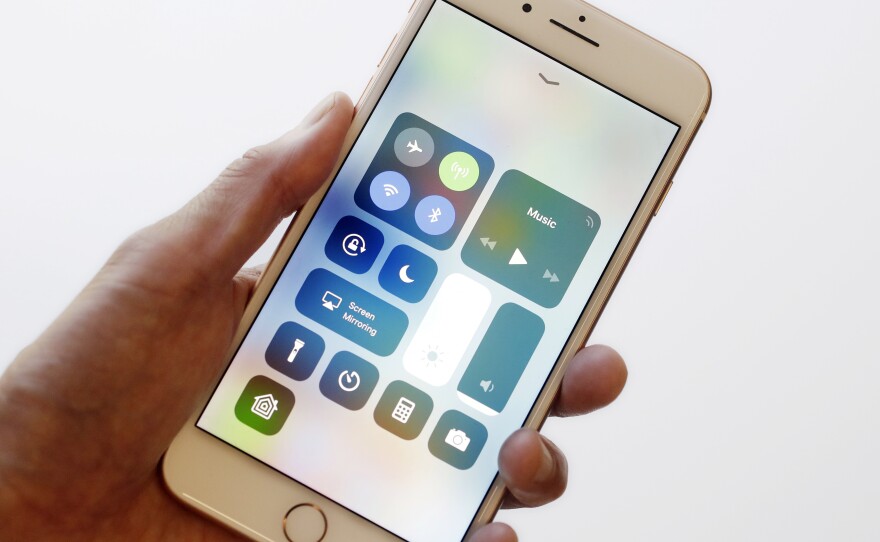 The iOS 11 control center is displayed on the iPhone 8 Plus in New York in September. Apple says its iOS devices are among those affected by the Meltdown vulnerability.