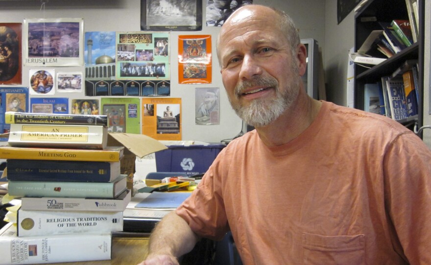 Rick Young, posing, is leaving his job at Daniel C. Oakes, a school outside of Denver after 25 years because he says the paperwork was overwhelming.
