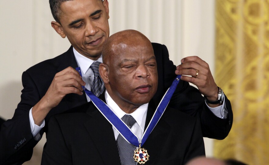 President Barack Obama presents a 2010 Presidential Medal of Freedom to U.S. Rep. John Lewis, D-Ga., during a ceremony in the East Room of the White House in Washington. The civil rights giant died Friday.