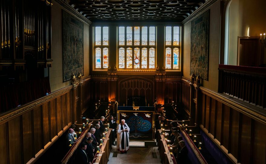 The anointing screen, handmade by the Royal School of Needlework, is blessed in front of a small congregation in the Chapel Royal at St. James's Palace in London on April 24. The most important moment in the coronation is the unction, the sacred act of anointing a monarch with holy oil, which signals that the monarch has been chosen by God. It will take place behind the anointing screen.