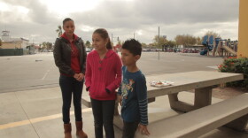 City Heights resident Norma Navarro is pictured with her children at Central Elementary School in 2013. Navarro's family is "mixed status," meaning her and her daughter are in the country illegally but her youngest was born here. Navarro and her daughter aren't eligible for full health coverage while her son is.