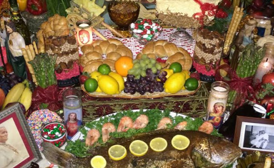 The Vaccarella family's altar to St. Joseph is a grandiose three-tiered shrine decorated with traditional foods, religious symbols and photos of loved ones.