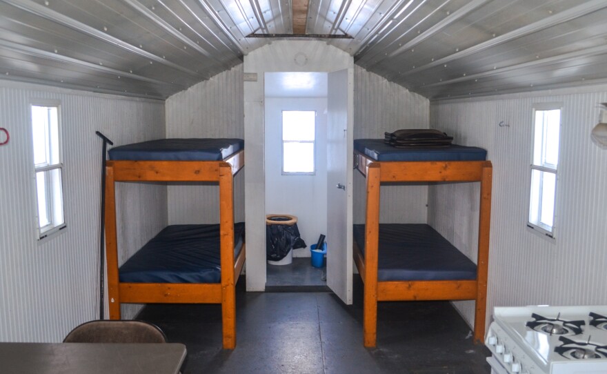 Inside a sleeper fish house. Houses like this allow ice fishers to stay out on the ice for days.