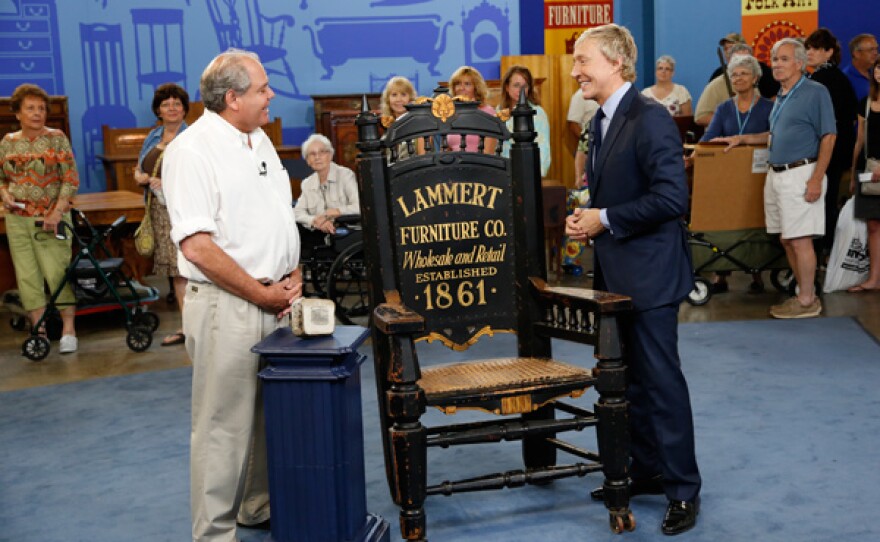 Leslie Keno appraises an advertising chair and printing stone for $10,000 to $20,000 in Kansas City, Missouri.