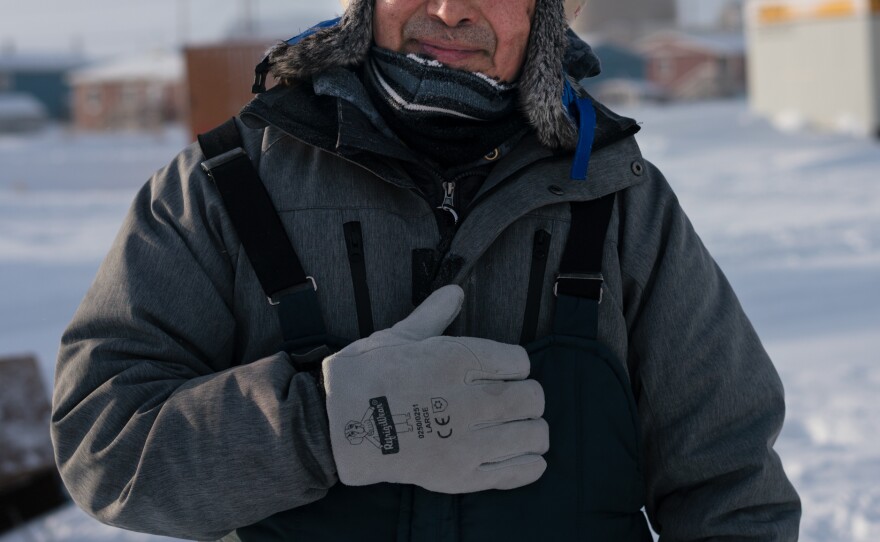 Tribal Administrator Robert Pitka stands outside in Toksook Bay in January preparing to ride a snow machine (known in the Lower 48 as a snowmobile) to neighboring Nightmute. There are no paved roads between the two villages.