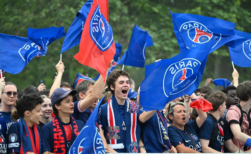 PSG fans celebrate the day after winning the Champions League title, at the Eiffel Tower, in Paris, Sunday, May 31, 2026.
