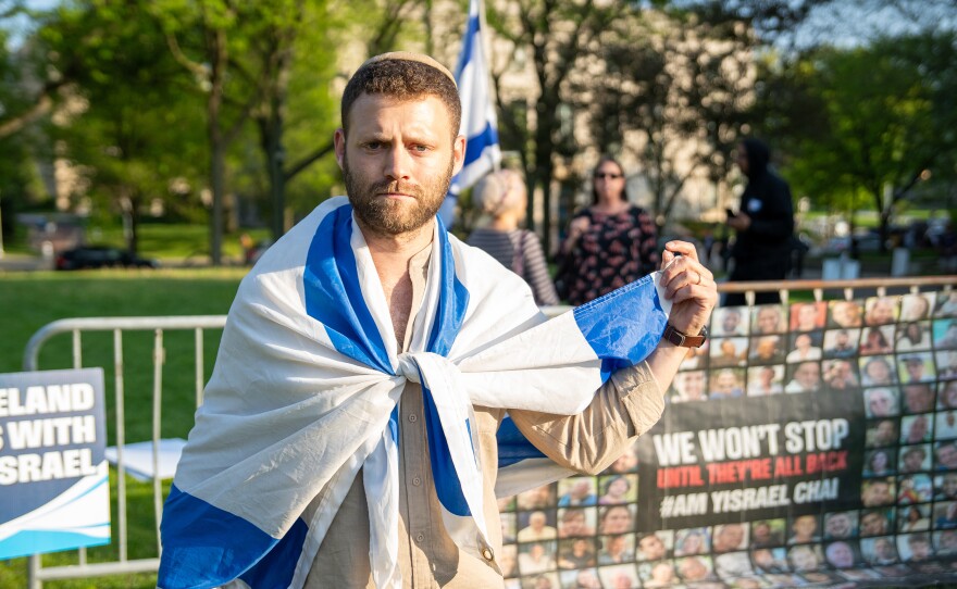 Counter-protester Betzalel, who would not give his last name, wore the flag of Israel at a protest on Case Western Reserve University's campus on May 2. He said wants peace but Hamas must release the hostages.