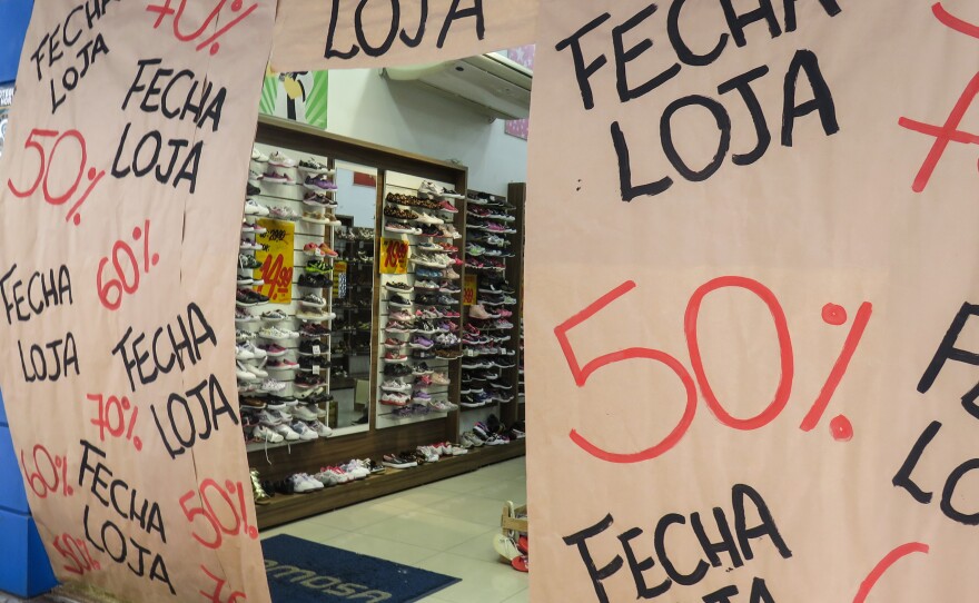 Amid Brazil's worst recession on record, shops like this one in Porto Alegre are holding final sales before they close.