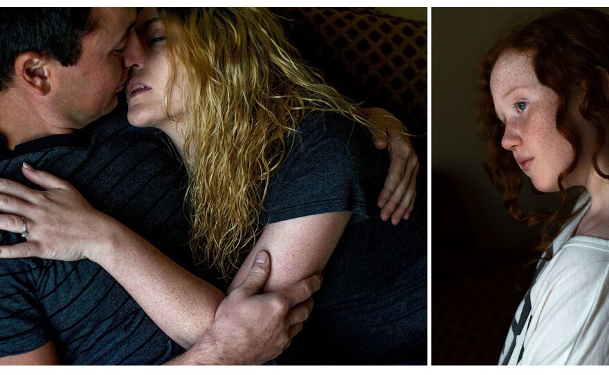 Alyssa kisses her fiancé, Morgan Still, at their home in Tulsa. At right is Alyssa's daughter MacKenzie, 10, visiting at her mother's home. Alyssa is in the process of gaining custody of MacKenzie.