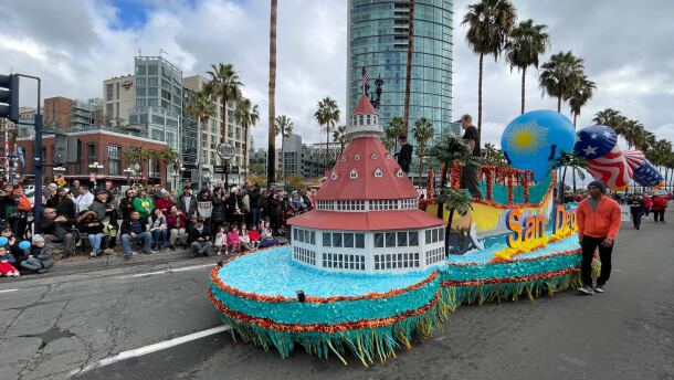 A float with a miniature of the Hotel Del Coronado and other San Diego landmarks in the Holiday Bowl Parade, Dec. 28, 2022.
