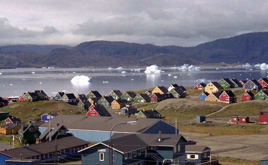 Giant icebergs float in the fjord in Narsaq, southern Greenland, the site of a controversial Australian-led uranium and rare-earth mining project. The open-pit mine has divided opinion on the island, which goes to the polls on Tuesday.