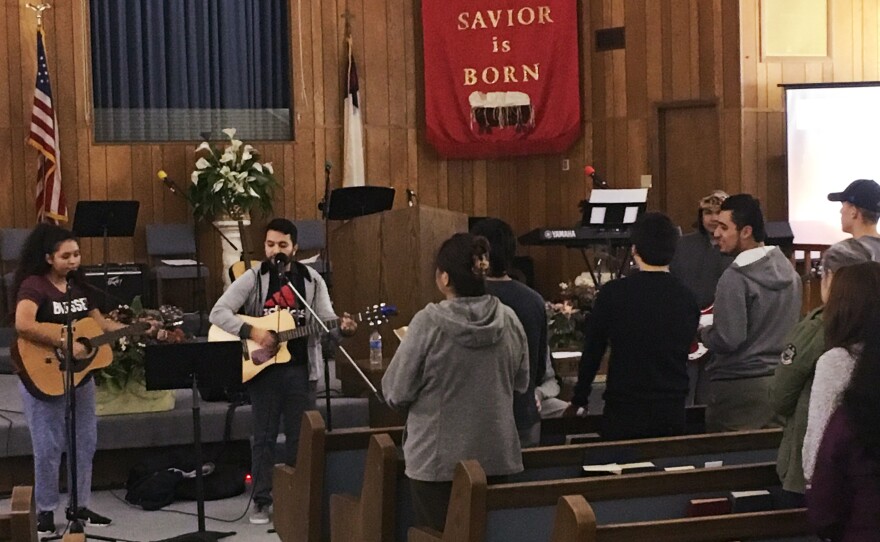 Young worshippers at Erez Baptist Church in Duncanville, Texas, gather for a midweek music service. The congregation, less than a year old, consists almost entirely of Hispanic immigrants and their children.