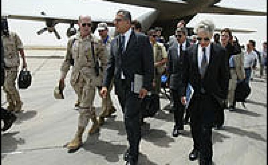 Ryan Crocker (right), arrives at the Tallil air base, north of Nasiriya, Iraq, with White House special envoy to Iraq Zalmay Khalilzad (center), and U.S. Maj. Gen. David Kratzer (left) in 2003.