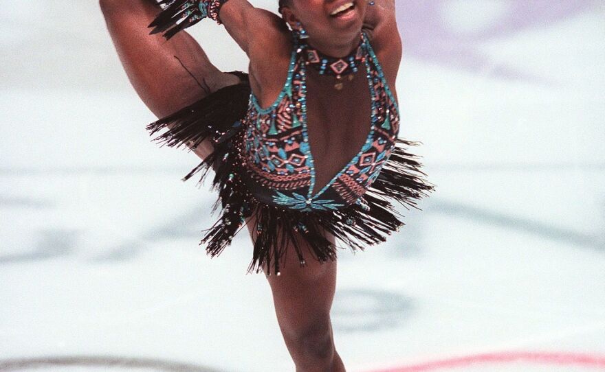 Surya Bonaly of France performs her short program in the women's figure skating competition at the 1998 Nagano, Winter Olympics. Bonaly was the first woman to attempt a quad jump in competition.