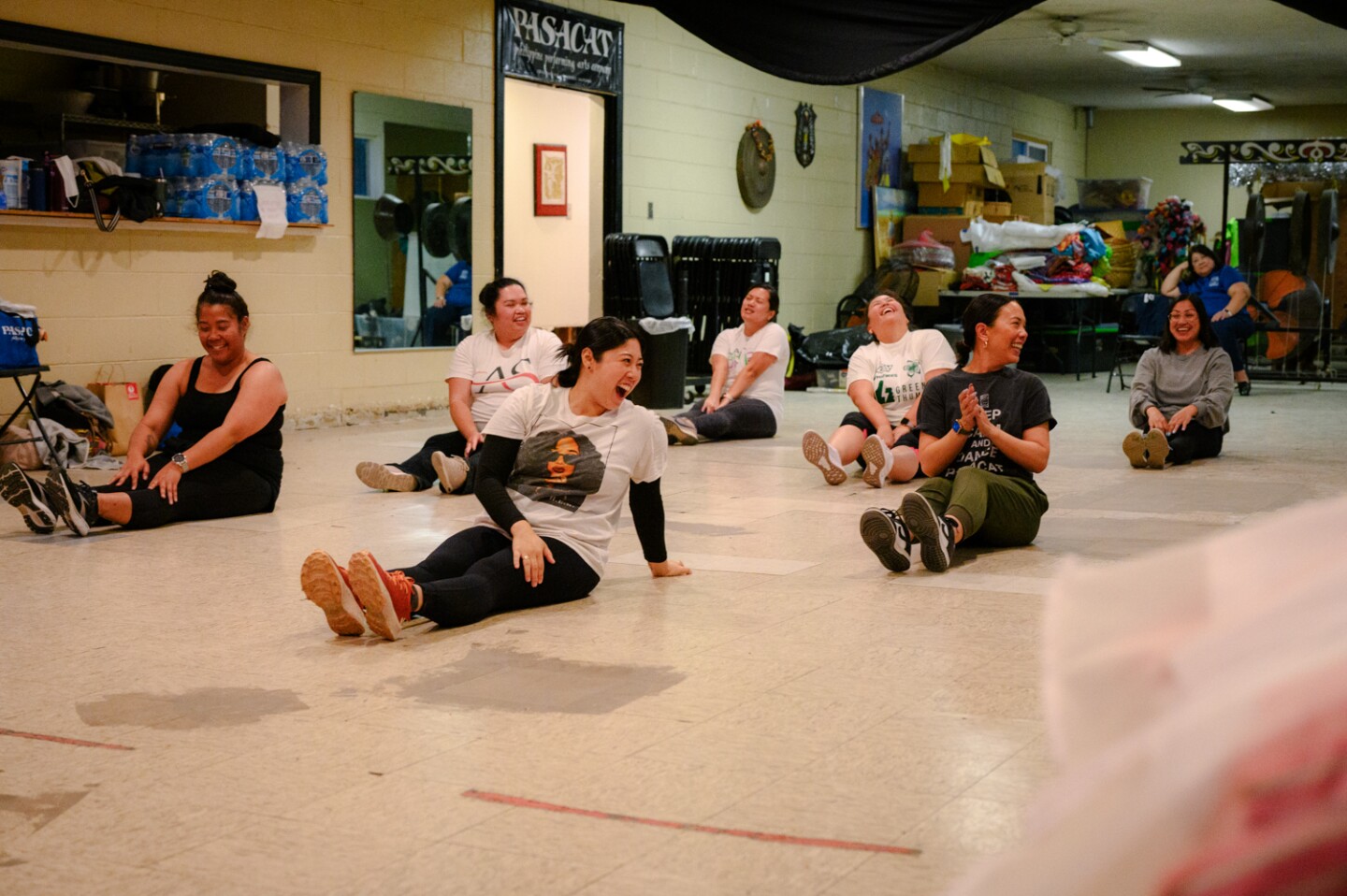 A new class of PASACAT dancers laughs while rehearsing a Binoyugan routine at the company’s studios in National City on April 23, 2024. The renowned Philippine arts company has faced years of flooding and is planning to build back stronger this time.