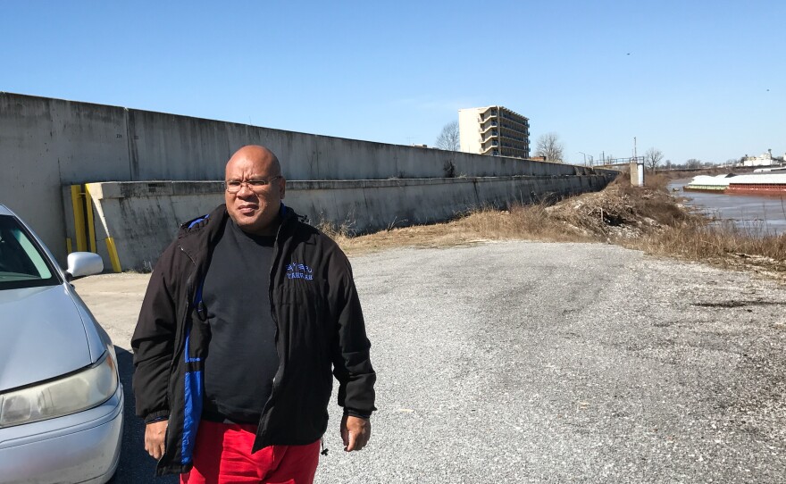 Pastor and community activist Phillip Matthews stands by a levee that protects the town from the Ohio River. Matthews says he's watched for 40 years as Cairo declined, battling outside economic forces, corruption and racial tension.