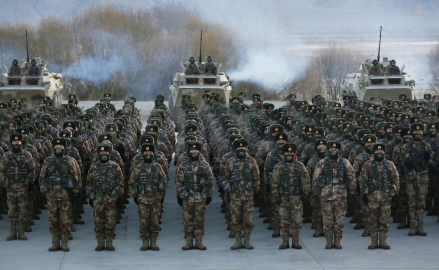 This Jan. 4 photo shows Chinese People's Liberation Army soldiers assembling during military training at Pamir Mountains in Kashgar, northwestern China's Xinjiang region.