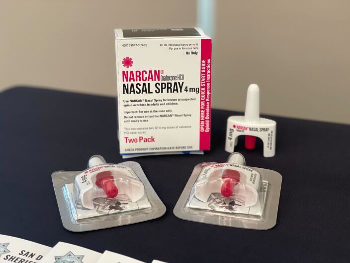 A table with Narcan Nasal spray is organized at a press conference, Jan. 23, 2023.