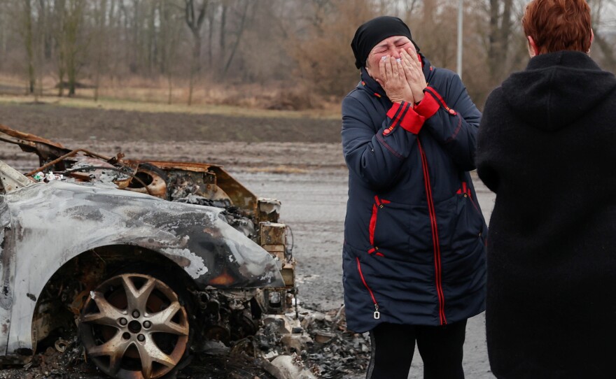 Oksana Breus cries as she arrives to pick up her son's body amid Russia's attack on Ukraine, in Nova Basan in April.