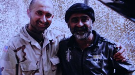 Hamed Dost (left) in Afghanistan in 2002. 