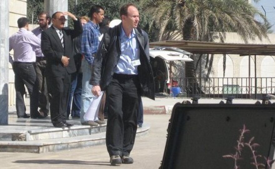 American journalist Ned Parker (foreground) is the Reuters bureau chief in Baghdad. He fled Iraq last week after receiving threats in response to reports on human rights abuses by Shiite militias allied with Iraq's government. He's shown here at Iraq's Foreign Ministry in 2007.