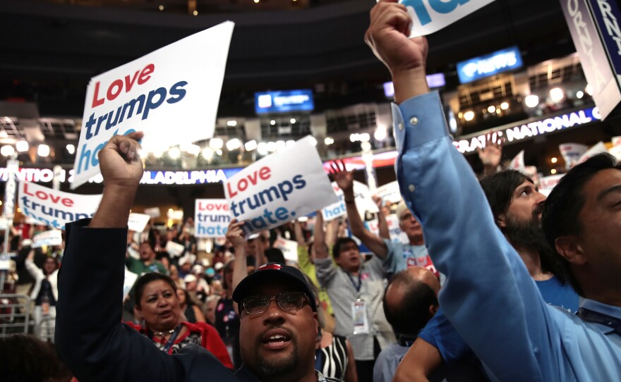 Delegates at the Democratic National Convention in Philadelphia in July hold up signs that read "Love trumps hate."