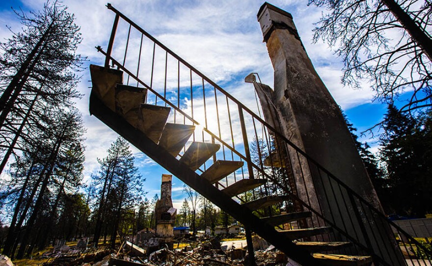 Part of a stairway still standing in the burned remains from a house in Paradise, Calif.