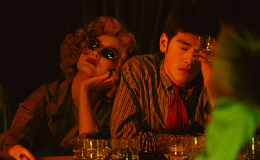 Brigitte Lin and Takeshi Kaneshiro meet by chance in a bar in Wong Kar Wai's "Chungking Express."