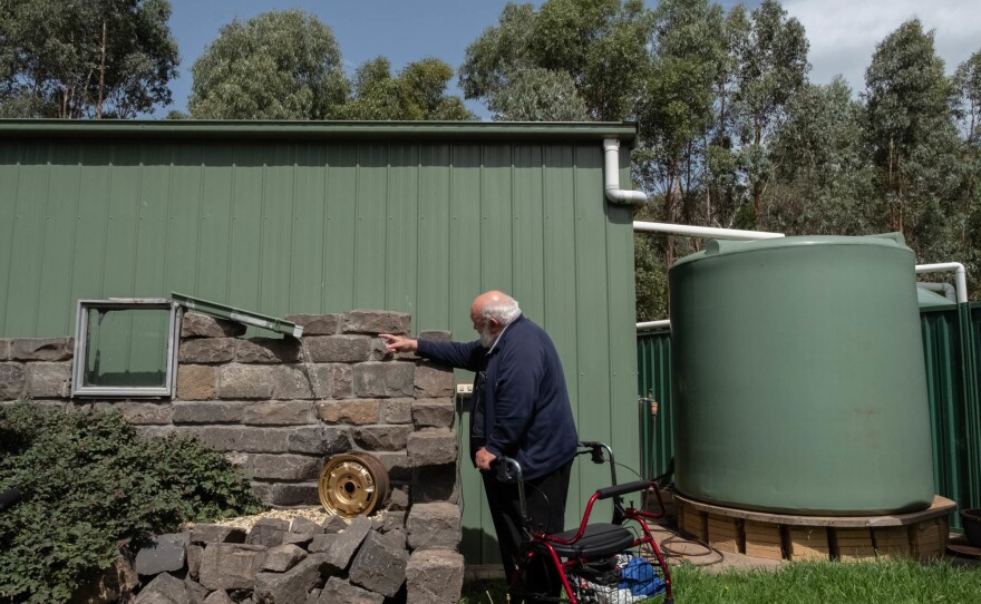 Behind his house, Milbourne added two large water tanks to help battle future fires.