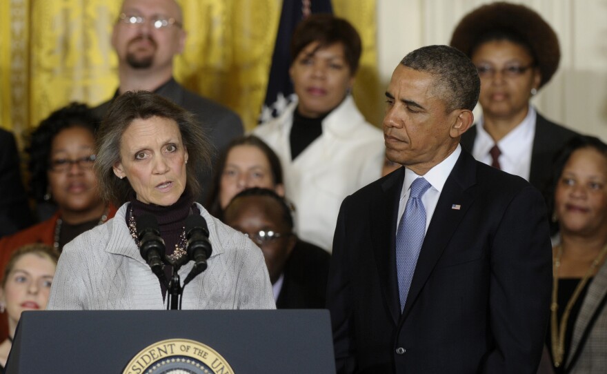 President Obama listens as Katherine Hackett of Moodus, Conn., speaks during an event in the East Room of the White House in Washington, on Tuesday.