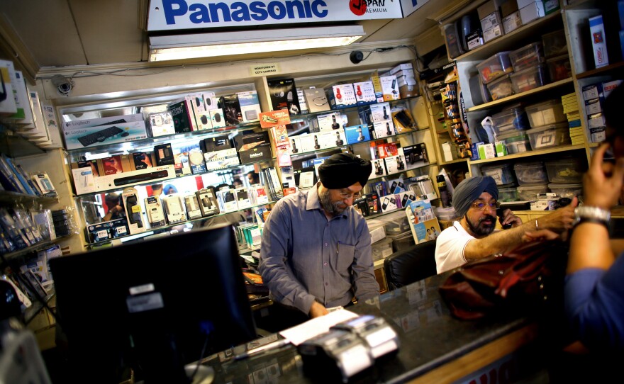 Indrajit Singh (left) and his brother Baljeet Singh (right) own an electronics shop in New Delhi. They saw a spike in sales of air filters as public awareness of the city's filthy air increased around the time of President Obama's visit last year.
