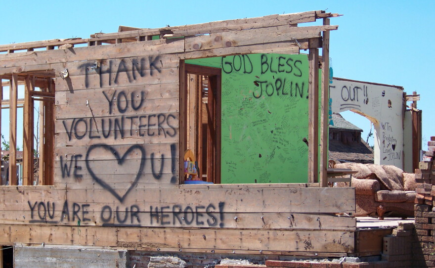 In the aftermath of the tornado,  thousands of volunteers came to help Joplin from around the country. Many wrote messages of hope on this tornado-damaged house, and later, Joplin residents wrote a thank-you message to the volunteers.