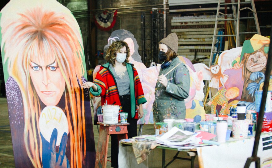 House floats are floating artists an economic life raft during the COVID pandemic. Coco Darrow (L) and Maddie Stratton (R) work on Mardi Gras decorations at The Stronghold Studios in New Orleans.