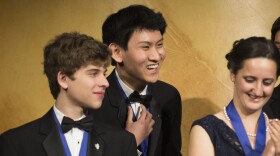 Eric S. Chen, 17, (center) wins the first-place prize of $100,000 in the Intel Science Talent Search, a program of Society for Science & the Public, March 11, 2014. 