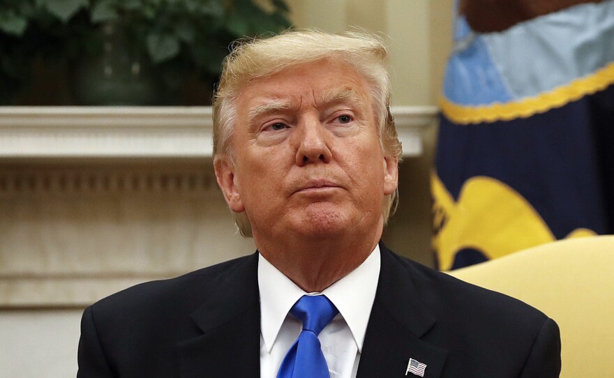 President Trump sits in the Oval Office of the White House in Washington on Tuesday.