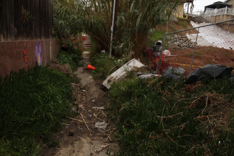 The stairs once served as a community gathering place and pathway to schools. Neighbors reported feeling unsafe walking through the stairs after the floods.