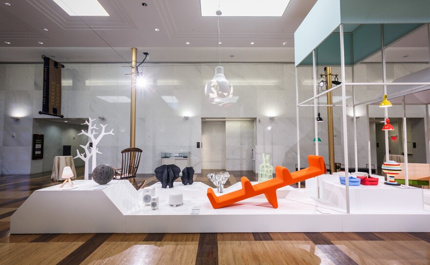 The Nordic design exhibit includes a lava rock, which Jukka Savolainen, director of the Design Museum in Helsinki, says reminds him of a gnome. The collection showcases the region's design roots, which include references to Bauhaus and 20th century modernism.
