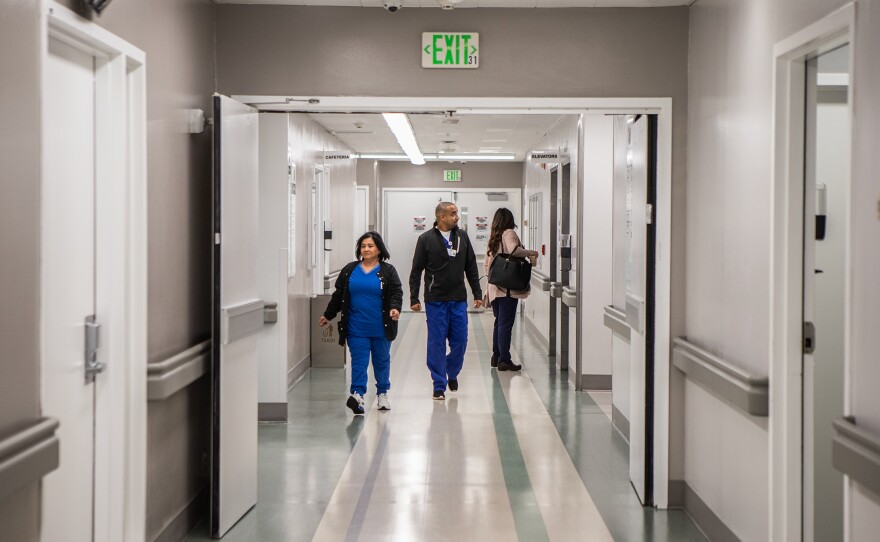 Medical personnel working in the intensive care unit at Madera Community Hospital on March 18, 2025. The hospital reopened after being closed for two years.