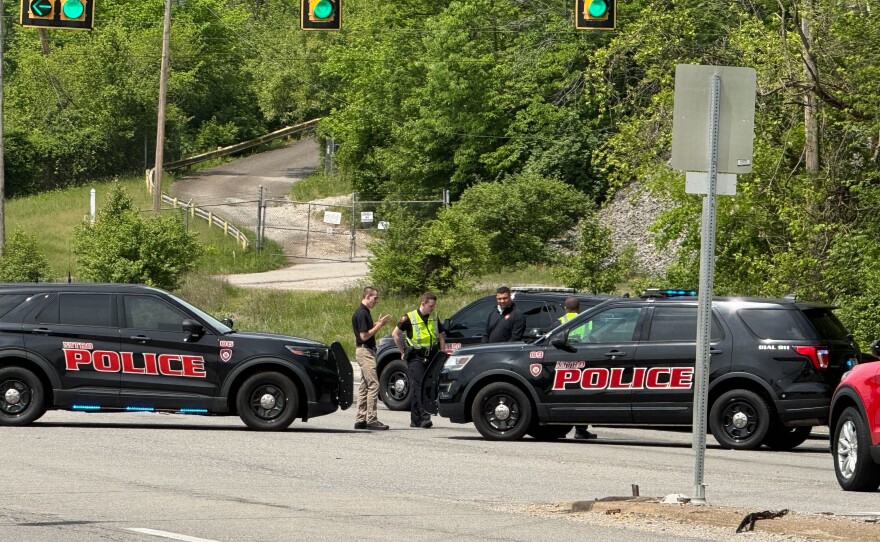 Police block a road near a chemical plant where a leak occurred Wednesday in Institute, W.Va.