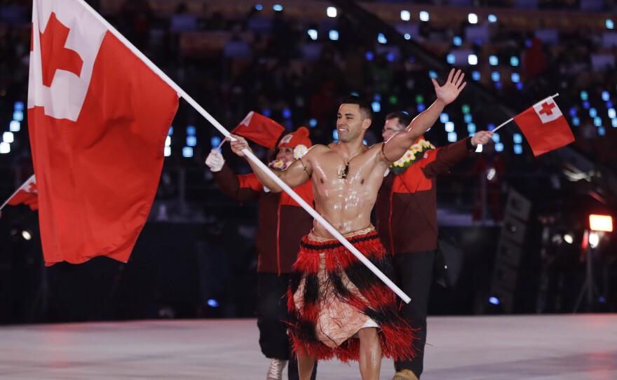 Pita Taufatofua makes an entrance during the opening ceremony of the 2018 Pyeongchang Winter Olympics. Taufatofua competed in taekwondo and cross-country skiing, but he's most famous for carrying the flag of Tonga for three consecutive Games, stealing the show each time.