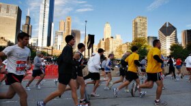 Runners take off from the starting point of the Chicago Marathon on Oct. 11.