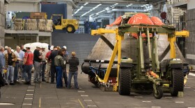 Orion spacecraft awaiting off-loading from USS Anchorage at Naval Base San Diego, December 8, 2014.