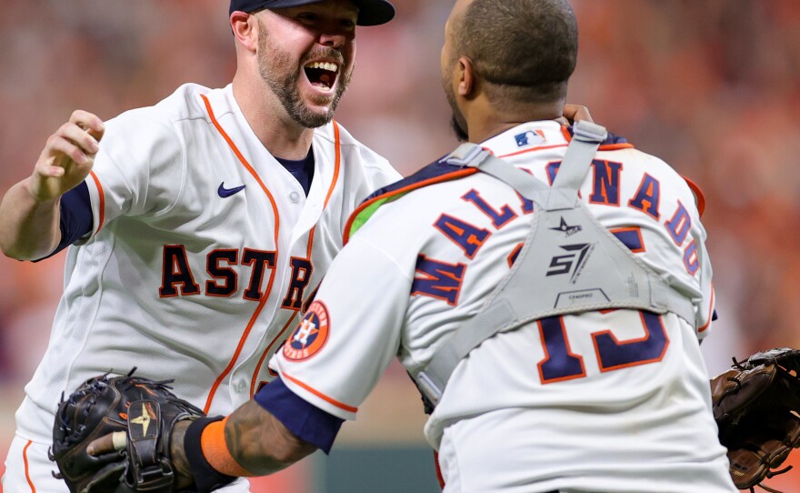 Ryan Pressly of the Houston Astros celebrates with Martin Maldonado after the final out in the ninth inning, defeating the Boston Red Sox 5-0 on Friday  and advancing to the World Series.