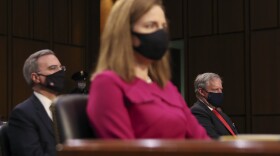 White House counsel Pat Cipollone, left, and White House Chief of Staff Mark Meadows listen during the confirmation hearing for Supreme Court nominee Amy Coney Barrett at the Senate Judiciary Committee on Capitol Hill in Washington, Monday, Oct. 12, 2020.