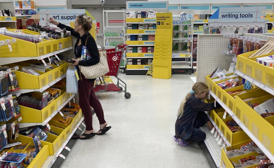 People shop for school supplies at a Target store in Miami, Fla., on July 27.