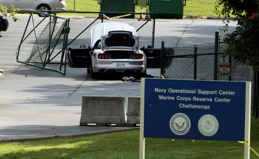 A car tangled in fencing sits inside the gate at the Naval Operational Support Center and Marine Reserve Center Friday, a day after a gunman killed four U.S. Marines in Chattanooga, Tenn.