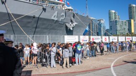 Students wait in line for a tour of amphibious dock landing ship USS Germantown (LSD 42) on Broadway Pier during Fleet Week San Diego in San Diego, Nov. 7, 2024.