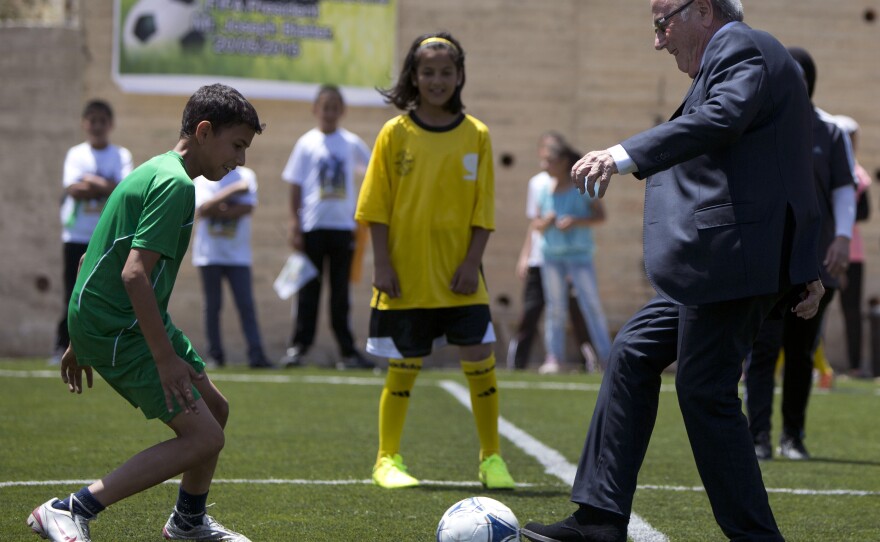 FIFA President Sepp Blatter kicks a ball during the inauguration of a football stadium in the village of Dura al-Qari near the West Bank city of Ramallah last week.